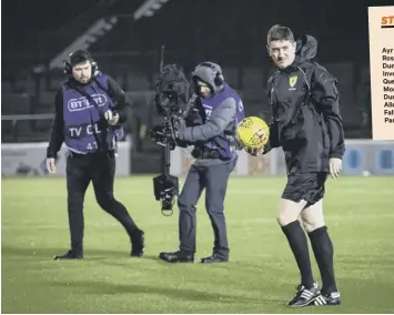  ??  ?? With the BT Sport team in situ, referee Craig Thomson inspects a windy Somerset Park.