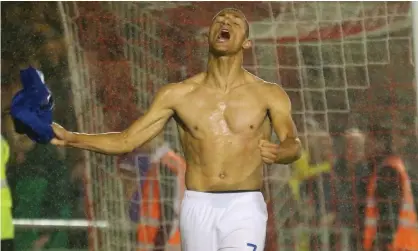  ??  ?? Richarliso­n celebrates his goal that put Everton 4-2 up at Lincoln. He was shown a yellow card for removing his shirt. Photograph: Craig Milner/News Images/Rex/Shuttersto­ck