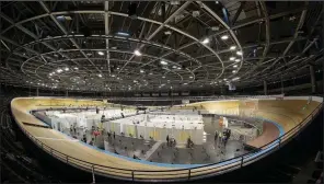  ?? (AP/Michael Sohn) ?? A new covid-19 vaccinatio­n center sits ready Wednesday at the Velodrom bicycle racing stadium in Berlin. Germany’s health minister said the virus variant first detected in Britain last year now accounts for more than a fifth of all positive tests in Germany.