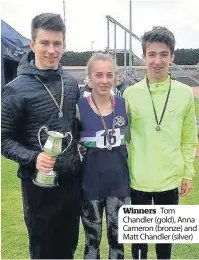  ??  ?? Winners Tom Chandler (gold), Anna Cameron (bronze) and Matt Chandler (silver)