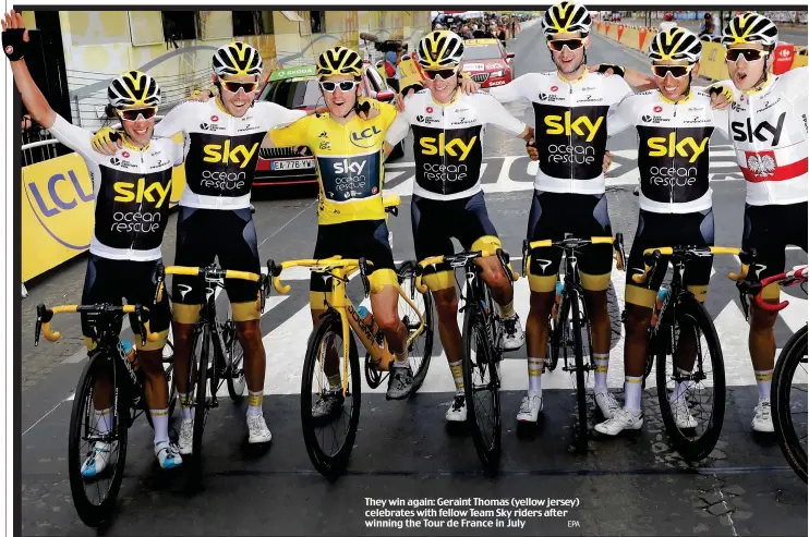  ?? EPA ?? They win again: Geraint Thomas (yellow jersey) celebrates with fellow Team Sky riders after winning the Tour de France in July