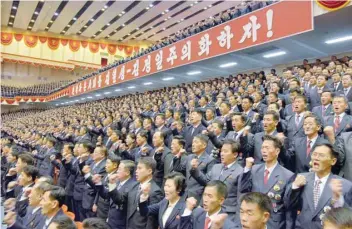  ?? — Reuters ?? Attendants of the 5th Conference of Cell Chairperso­ns of the Workers’ Party of Korea (WPK) hold a meeting to accept a pledge for North Korean leader Kim Jong-Un, in this photo released by North Korea’s Korean Central News Agency (KCNA) in Pyongyang on...