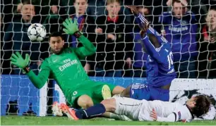  ?? AFP ?? Chelsea striker Demba Ba scores during the Champions League quarter-final against PSG. —