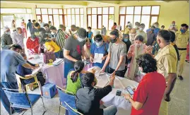  ??  ?? People register their names to receive a dose of vaccine in Gurugram on Wednesday.