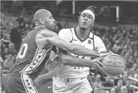  ?? TREVOR RUSZKOWSKI/USA TODAY SPORTS ?? Pacers center Myles Turner, right, battles the 76ers’ Nicolas Batum on Jan. 25 at Gainbridge Fieldhouse.