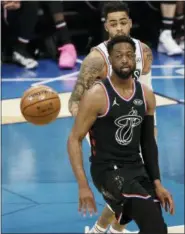  ?? GERRY BROOME — THE ASSOCIATED PRESS ?? Team LeBron’s Dwayne Wade, of the Miami Heat, moves toward the ball against Team Giannis during the first half of an NBA All-Star basketball game, Sunday in Charlotte, N.C.