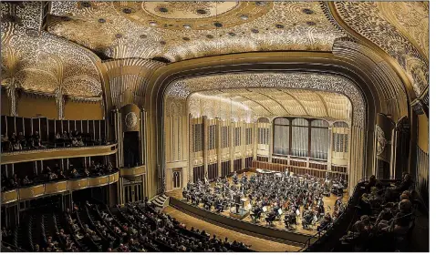  ?? Los Angeles Times (TNS)/MARCUS YAM ?? The Cleveland Orchestra plays to a rapt audience beneath the intricate aluminum ceiling at Severance Hall. The hall is a bright spot in a city on the rebound from a decades-long slump.