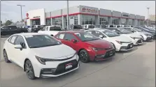  ?? RICK BOWMER - THE ASSOCIATED PRESS FILE PHOTO ?? In this May 12, 2020 photo, Toyota’s are shown on the lot of Mark Miller Toyota Dealership in Salt Lake City. One of COVID-19′s impacts has been the reduction in interest rates, including those for auto loans. In June 2020, the average interest rate for new auto loans decreased to 4.2%, down from 6.0% one year ago, according to Edmunds. But Americans are buying more expensive vehicles, which means monthly payments have increased year over year.