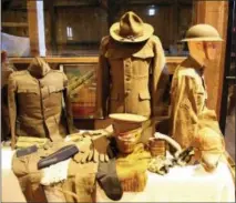  ?? FILE PHOTO ?? Uniform pieces of men who fought in World War I.