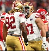  ?? JOSE CARLOS FAJARDO – BAY AREA NEWS GROUP ?? The 49ers' Chase Young (92) and Nick Bosa (97) celebrate after sacking Kansas City Chiefs quarterbac­k Patrick Mahomes (15) in the first quarter of the Super Bowl in Las Vegas, Nev., on Feb. 11.