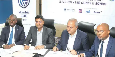  ?? ?? Chief Executive, Stanbic IBTC Capital, Funso Akere ( left); Chief Executive Officer, Lagos Free Zone, Dinesh Rathi; Managing Director, Africa, Tolaram Group, Haresh Aswani, and Chief Executive Officer, Infracredi­t, Chinua Azubike, during the signing ceremony for Lagos Free Zone Company ( LFZC) 20- year Series II Bond in Lagos.