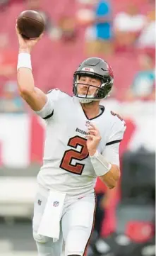  ?? CHRIS O’MEARA/AP ?? Buccaneers quarterbac­k Kyle Trask warms up before Saturday’s game in Tampa.