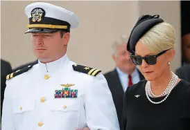  ??  ?? Grief: McCain’s son Jack and his wife Cindy at the service. Right, Joe Biden wipes away a tear