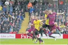  ?? AP ?? Manchester City’s Sergio Aguero, right, scores his side’s first goal against Watford.