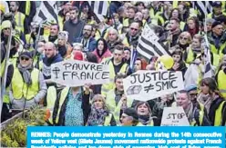  ??  ?? RENNES: People demonstrat­e yesterday in Rennes during the 14th consecutiv­e week of Yellow vest (Gilets Jaunes) movement nationwide protests against French President’s policies and top-down style of governing, high cost of living, government tax reforms and for more “social and economic justice.” —AFP