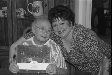  ?? Rappahanno­ck News Staff Photo/jan Clatterbuc­k ?? PHOTO ALBUM: Anna Clatterbuc­k wears a big smile after granddaugh­ter Emily Dodson presented her with an album of photos for her birthday on Sunday.