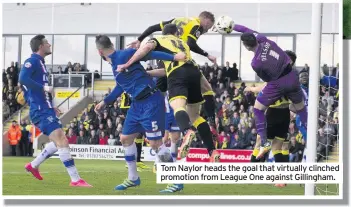  ??  ?? Tom Naylor heads the goal that virtually clinched promotion from League One against Gillingham.