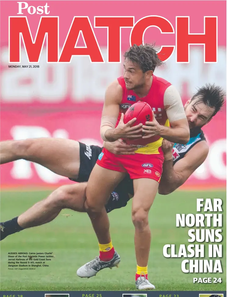  ?? Picture: AAP Image/DAVID MARIUZ ?? AUSSIES ABROAD: Cairns juniors Charlie Dixon of the Port Adelaide Power tackles Jarrod Harbrow of the Gold Coast Suns during the Round 9 AFL match at Jiangwan Stadium in Shanghai, China.