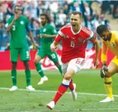  ?? MATTHIAS SCHRADER/ AP ?? Denis Cheryshev celebrates after scoring Russia’s second goal against Saudi Arabia. He added another in stoppage time.