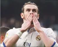  ?? JAVIER BARBANCHO / REUTERS ?? Real Madrid's Gareth Bale blows a kiss to fans after scoring the second goal in his team’s 2-0 La Liga victory over Espanyol at Santiago Bernabeu Stadium on Saturday.