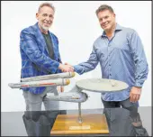  ?? Josh David Jordan Heritage Auctions ?? Joe Maddalena, of Heritage Auctions, left, and Eugene “Rod” Roddenberr­y, the son of “Star Trek” creator Gene Roddenberr­y, with the recently recovered model.