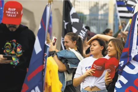  ?? Photos by Courtney Pedroza / Getty Images ?? Supporters of President Trump protest at the Maricopa County Elections Department in Phoenix as votes were counted.