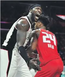  ??  ?? MONTREZL HARRELL screams after a dunk during the second quarter. Harrell had 21 points, but there wasn’t much to shout about for the Clippers, who were without Kawhi Leonard.