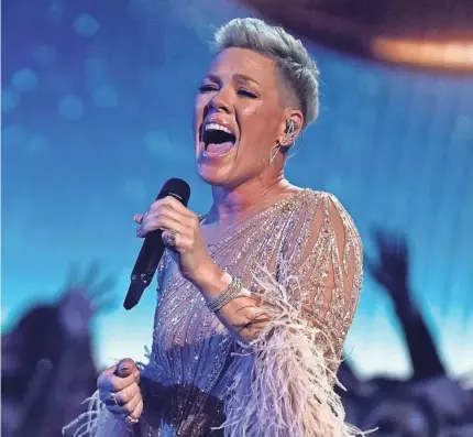  ?? CHRIS PIZZELLO/INVISION/AP ?? Pink, performing “Hopelessly Devoted to You” during a tribute to Olivia Newton-John at the American Music Awards on Nov. 20, 2022, in Los Angeles, has released her ninth album, “Trustfall.”