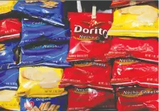  ?? MARK LENNIHAN/THE ASSOCIATED PRESS FILES ?? Cool Ranch Doritos are out of production, one of dozens, of products temporaril­y halted in March as manufactur­ers struggled to keep pace with the demand for snacks.