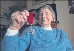  ??  ?? Susan Travers, the only woman to join the French Royal Legion, with her Legion of Honour medal. She died in 2003 aged 94