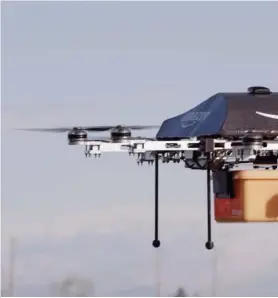  ??  ?? An Amazon Prime Air drone completed its first delivery on Dec. 14 to a customer outside Cambridge in the United Kingdom.
