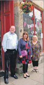  ??  ?? Community shop staff Alan Roache, Morag McMillan and Liz Croft with the basket.