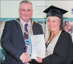  ??  ?? Laura Farrell from Wexford receiving her certificat­e in manual & computeris­ed accounts from Waterford mayor Sean Reinhardt.
