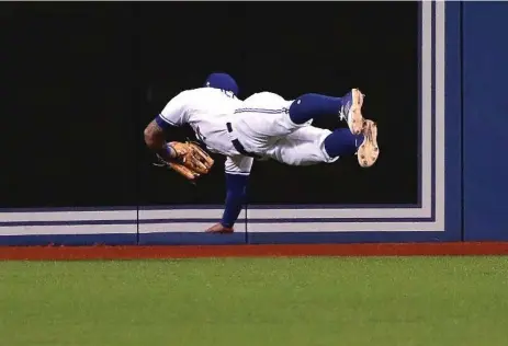  ?? STEVE RUSSELL/TORONTO STAR ?? Jays centre fielder Kevin Pillar was at his highlight-reel best again Monday, taking extra bases away from Cleveland’s Jose Ramirez to end the sixth inning.