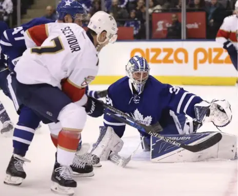  ?? RICHARD LAUTENS/TORONTO STAR ?? Frederik Andersen turned aside 29 of 31 Florida shots, including this sparkling glove save on the Panthers’ Colton Sceviour in the second period.