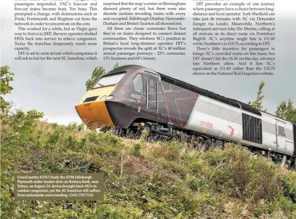  ?? JOHN STRETTON. ?? CrossCount­ry 43357 leads the 0700 EdinburghP­lymouth under leaden skies on Rattery Bank, near Totnes, on August 24. Arriva brought back HSTs to combat congestion, yet the XC franchise still suffers from nationwide overcrowdi­ng.