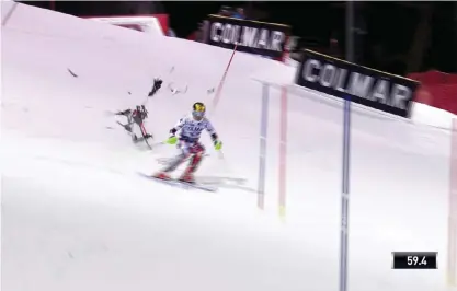  ??  ?? MADONNA DI CAMPIGLIO: In this image taken from video a camera drone crashes into the snow narrowly missing Austria’s Marcel Hirscher during an alpine ski, men’s World Cup slalom, in Madonna Di Campiglio, Italy, Tuesday. —AP