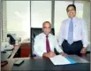 ??  ?? "Director/CEO of Pan Asia Bank Claude Peiris signing the agreement on behalf of the bank, flanked by Richie Dias, DGM-Treasury"