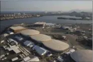  ?? FELIPE DANA — THE ASSOCIATED PRESS FILE ?? In this file photo, the Olympic Park of the 2016 Olympics is seen from the air, in Rio de Janeiro, Brazil. Almost one year after the games, Olympic Park in suburban Barra da Tijuca, which was the largest cluster of venues, is an expanse of empty arenas...