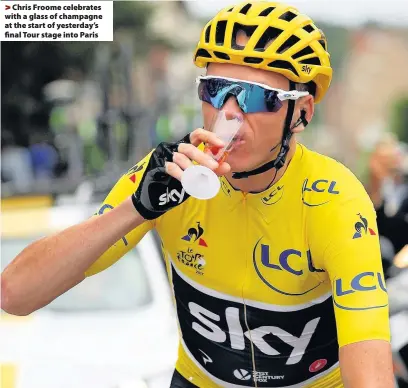  ??  ?? > Chris Froome celebrates with a glass of champagne at the start of yesterday’s final Tour stage into Paris