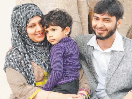  ?? ?? Dr Mohamed Haneef with wife Firdous Arshiya and daughter Haniya Kulthum, who was born days before his arrest.