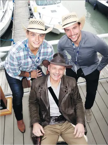  ??  ?? Vancouver Canucks forwards Jake Virtanen and Sven Baertschi backed Canucks Autism Network co-founder and team co-owner Paolo Aquilini at a Fishing For Kids tournament sendoff reception. The tournament, marking its 13th year, reportedly raised $1 million.