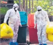  ?? ANI FILE ?? Medical staff wears protective suits and holds medical waste as they exit the Special Isolation Ward at Kochi Medical college, in Kerala on Saturday