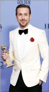  ?? The Associated Press ?? Canadian Ryan Gosling poses with the award for best performanc­e by an actor in a motion picture — musical or comedy for “La La Land” at the 74th annual Golden Globe Awards, Sunday.