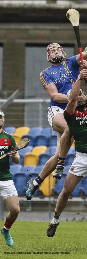  ??  ?? Wicklow’s Pádraig Doyle flies above Mayo’s Cathal Freeman.