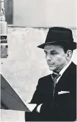  ?? HERMAN LEONARD/ NATIONAL PORTRAIT GALLERY ?? Alone at the microphone: Frank Sinatra.