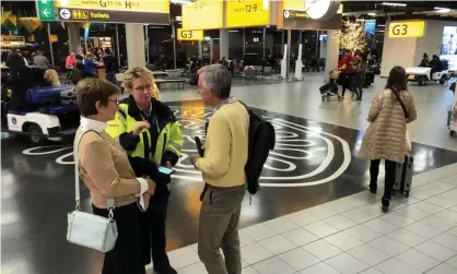  ?? Photograph: Amir Cohen/Reuters ?? People inside the terminal of Amsterdam’s Schiphol airport. Police initially said they were investigat­ing a ‘suspicious situation’.