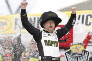  ?? AP PHOTO/ELLEN SCHMIDT ?? NASCAR Cup Series driver William Byron celebrates in victory lane Sunday at Las Vegas Motor Speedway.