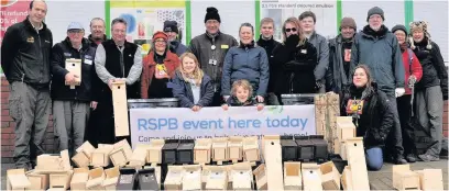  ??  ?? ●● The team with their collection of completed nest boxes – different types for different species