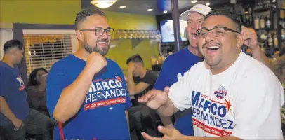  ?? Rachel Aston ?? Marco Hernandez, who is running for Clark County Commission District E, from left, is cheered on by Les Boelman and Rogelio Gonzalez at his watch party Tuesday at the Service Employee Internatio­nal Union’s offices. Las Vegas Review-journal @rookie__rae